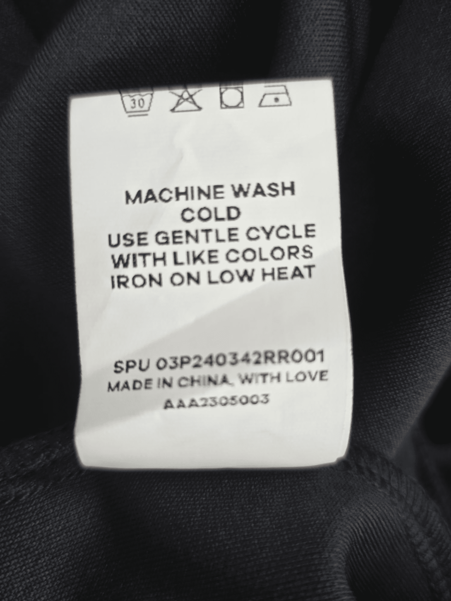 Material and Care Tag for BloomChic Black Cropped Pants Size 18/20 – Polyester Spandex Blend Machine Washable