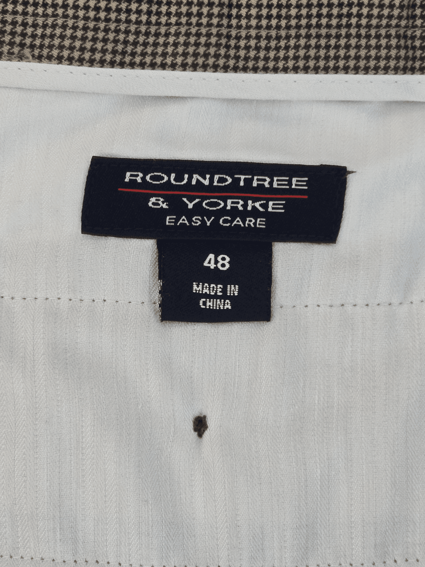Roundtree & Yorke brand and size 48 clothing label