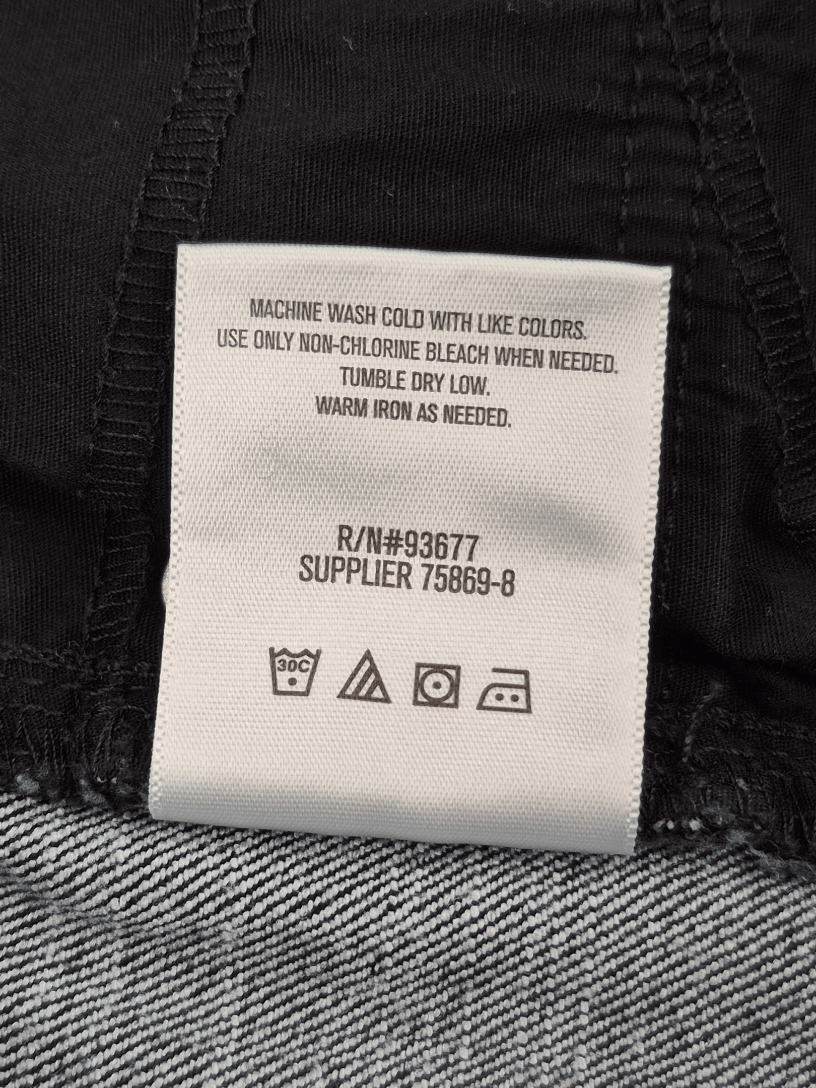 Close-up of material content and garment care tag on Liz Claiborne Woman size 22W Ultimate Fit dark wash jeans