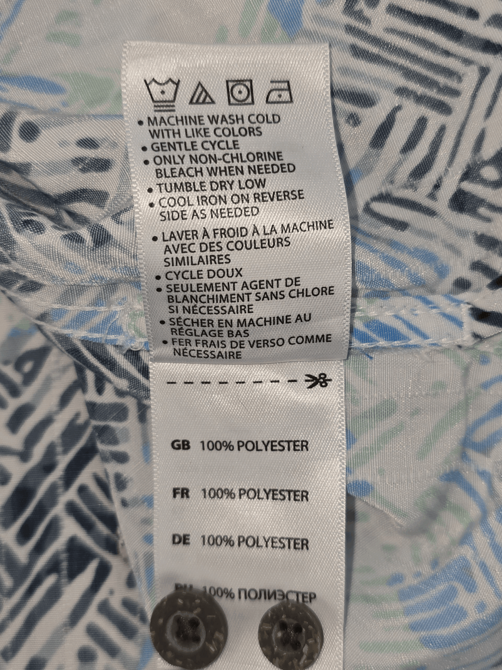 Close-up of material content and garment care tag on Island Passport men’s 2XLT multicolor abstract button-up shirt