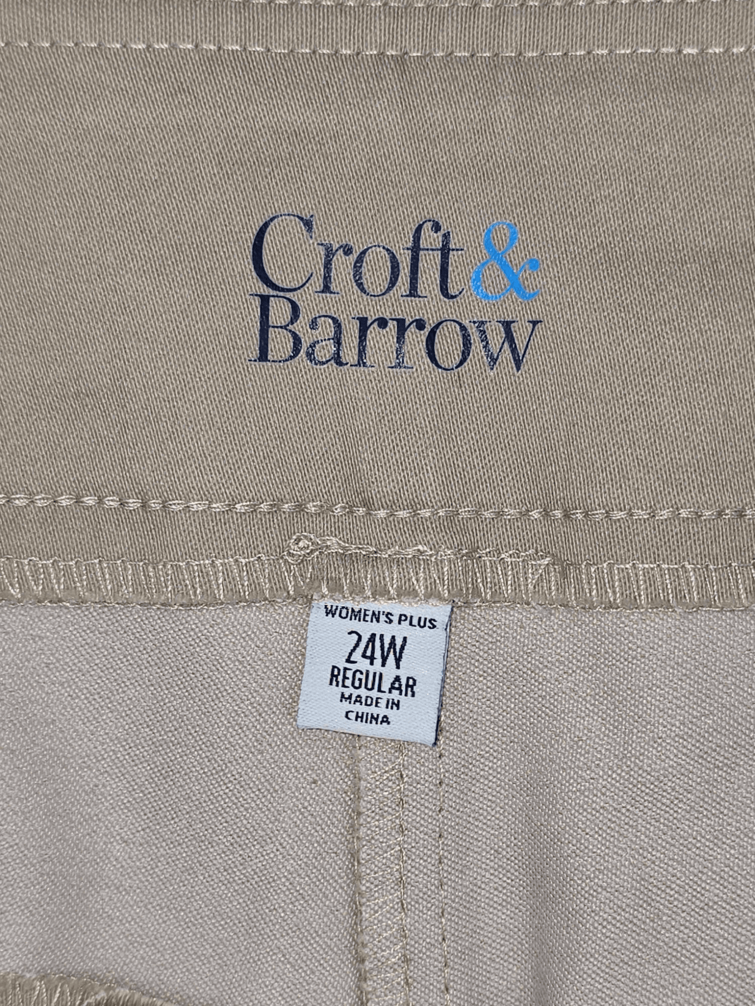 Close-up of Croft & Barrow brand and 24W size tag on khaki pull-on straight-leg pants
