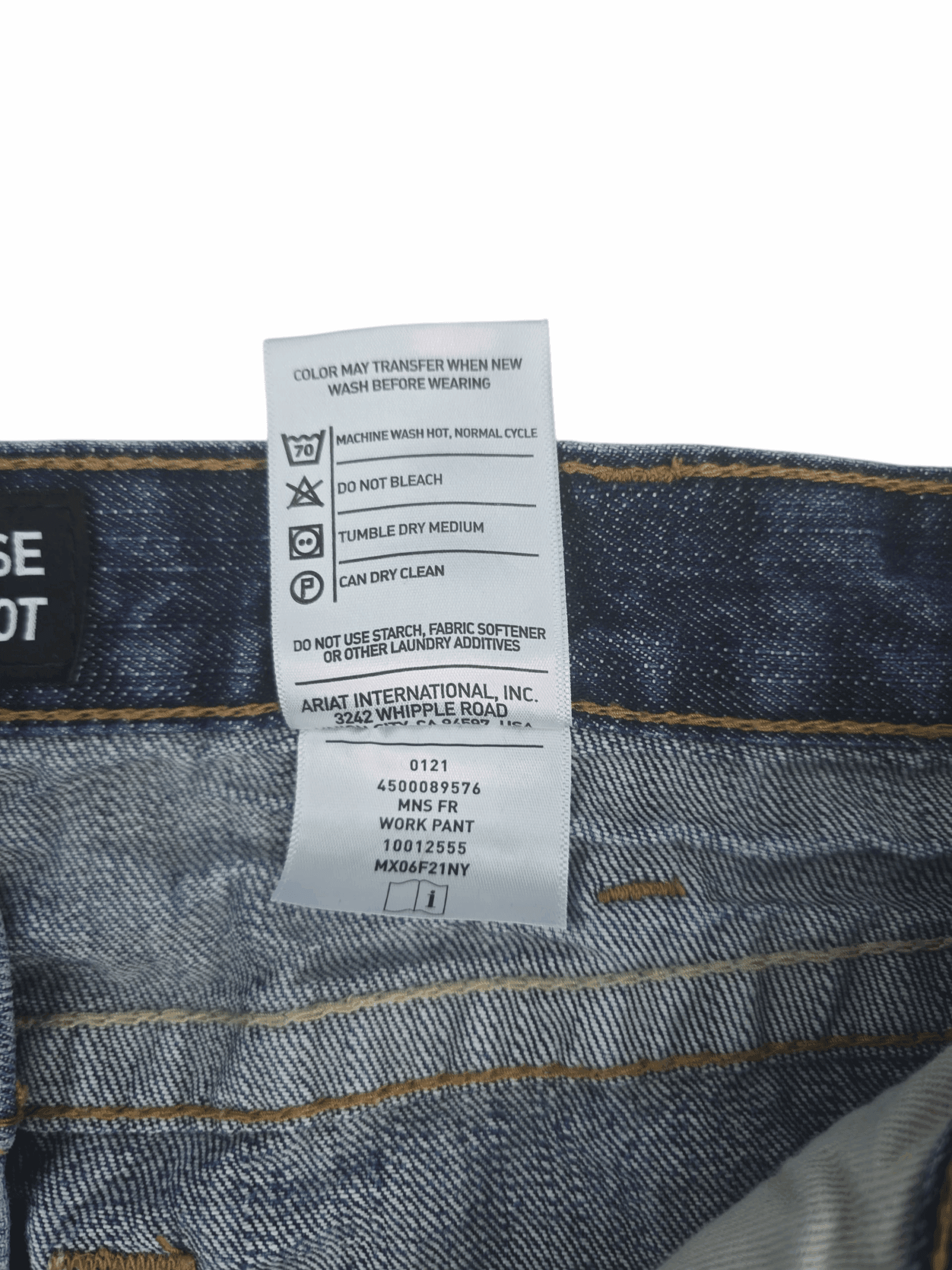Close-up of material content and garment care tag on Ariat men’s size 40x32 M4 FR low-rise bootcut jeans