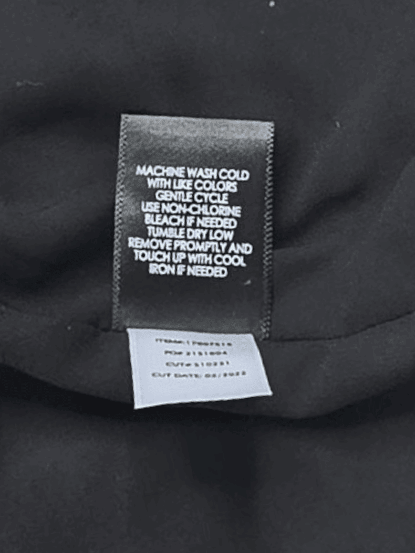 Close-up of material content and garment care tag on Torrid women’s plus size 4X Sophie floral cami top