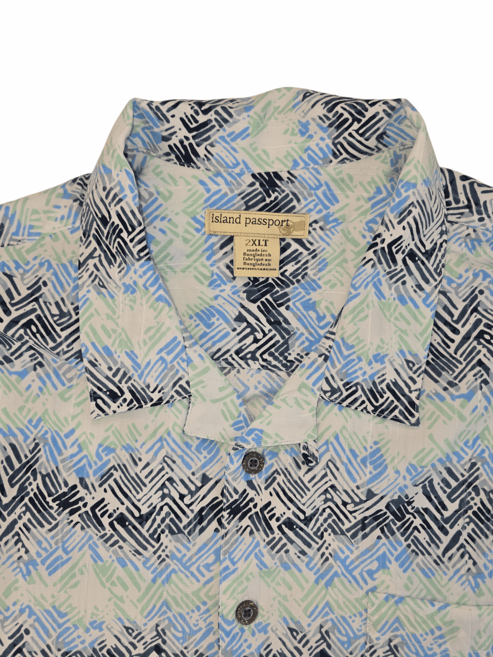 Close-up of Island Passport brand and 2XLT size tag on multicolor abstract button-up shirt