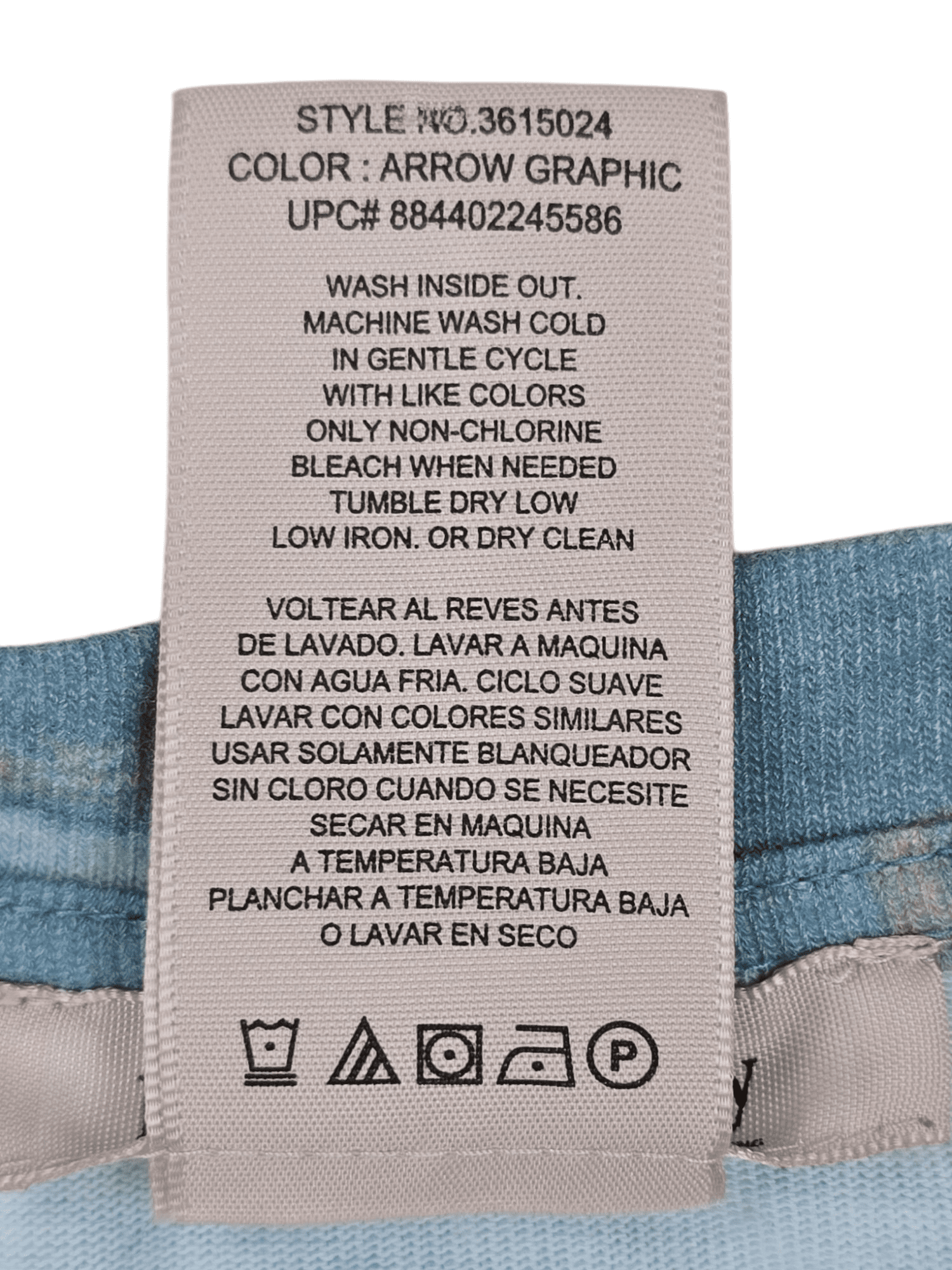 Close-up of Philosophy brand and XXL size tag on aqua blue scoop neck pullover top