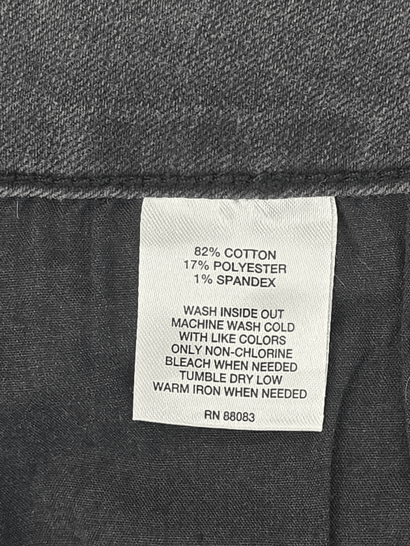 Hannah black tapered leg button detail ankle jeans material content label