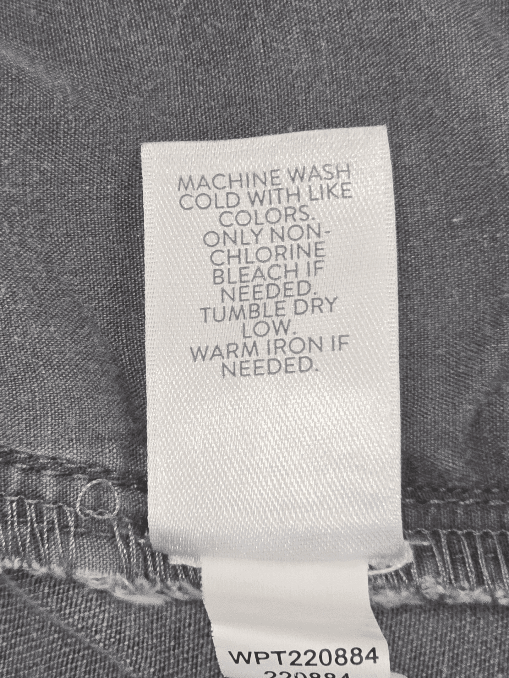 Close-up of material content and garment care tag on J. Jill women’s size 22W stretch denim capris