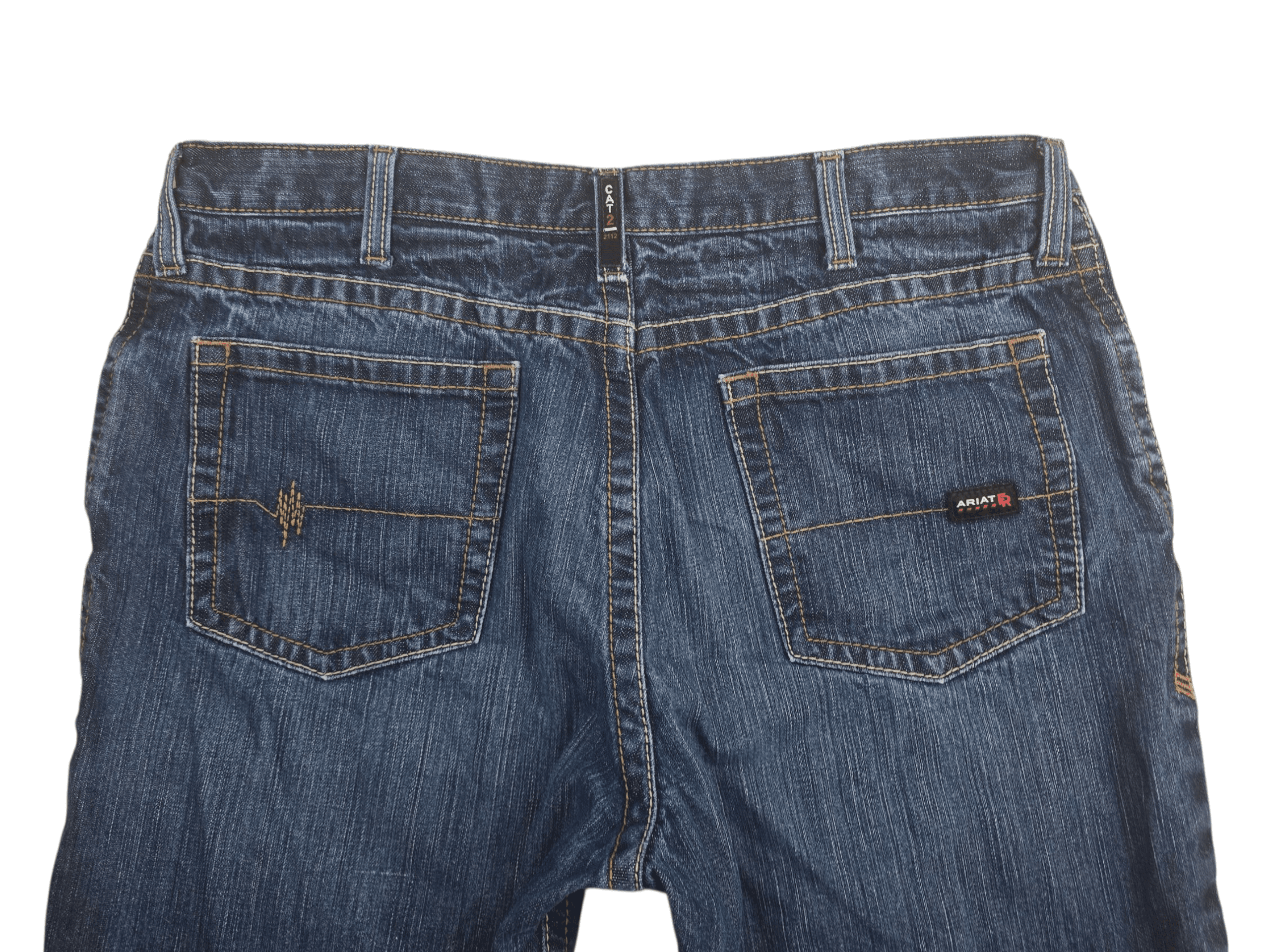 Close-up of Ariat leather brand patch on back waistband of M4 FR low-rise bootcut jeans