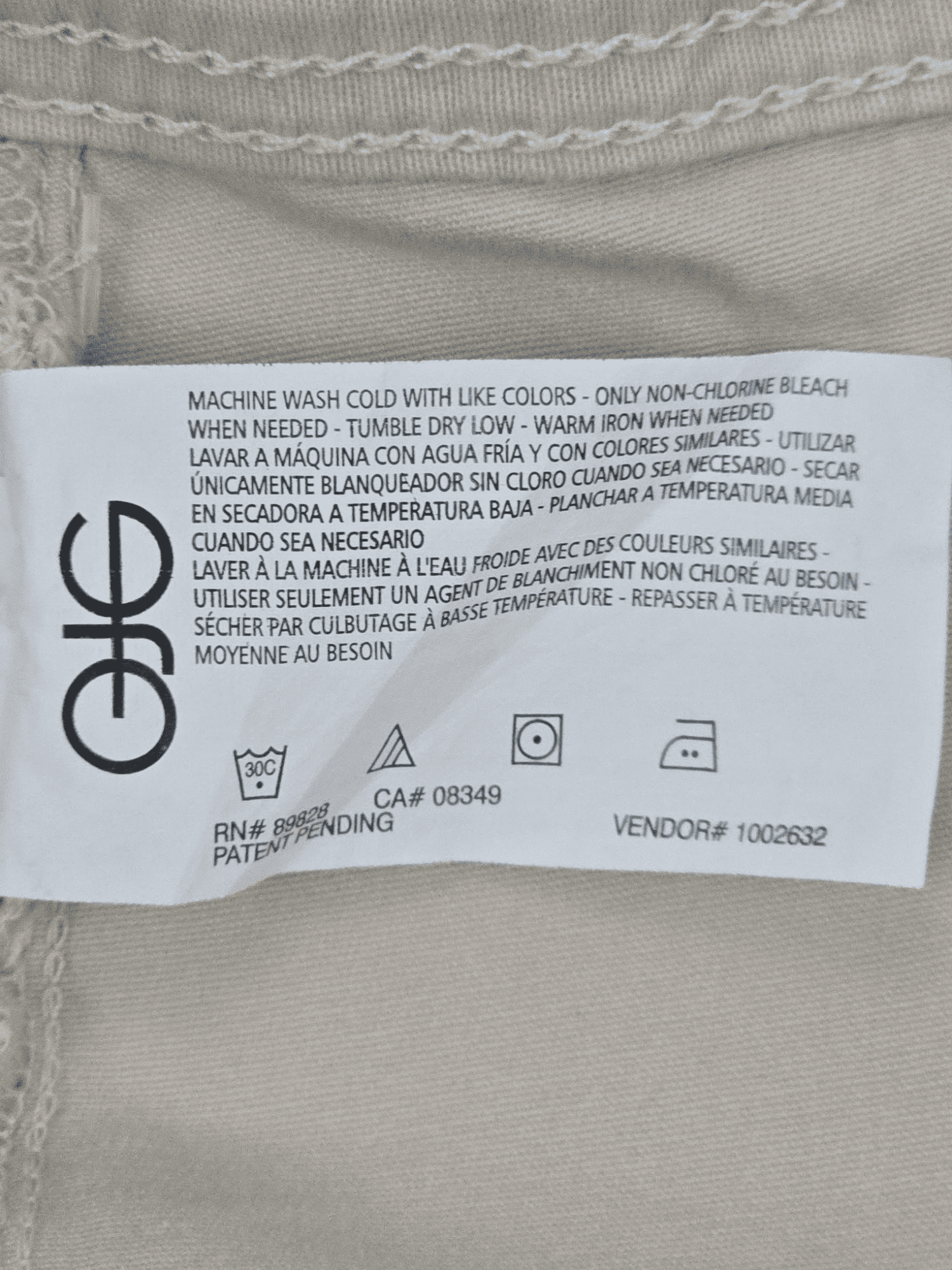 NWT Gloria Vanderbilt light tan Bermuda shorts with belt care instructions tag