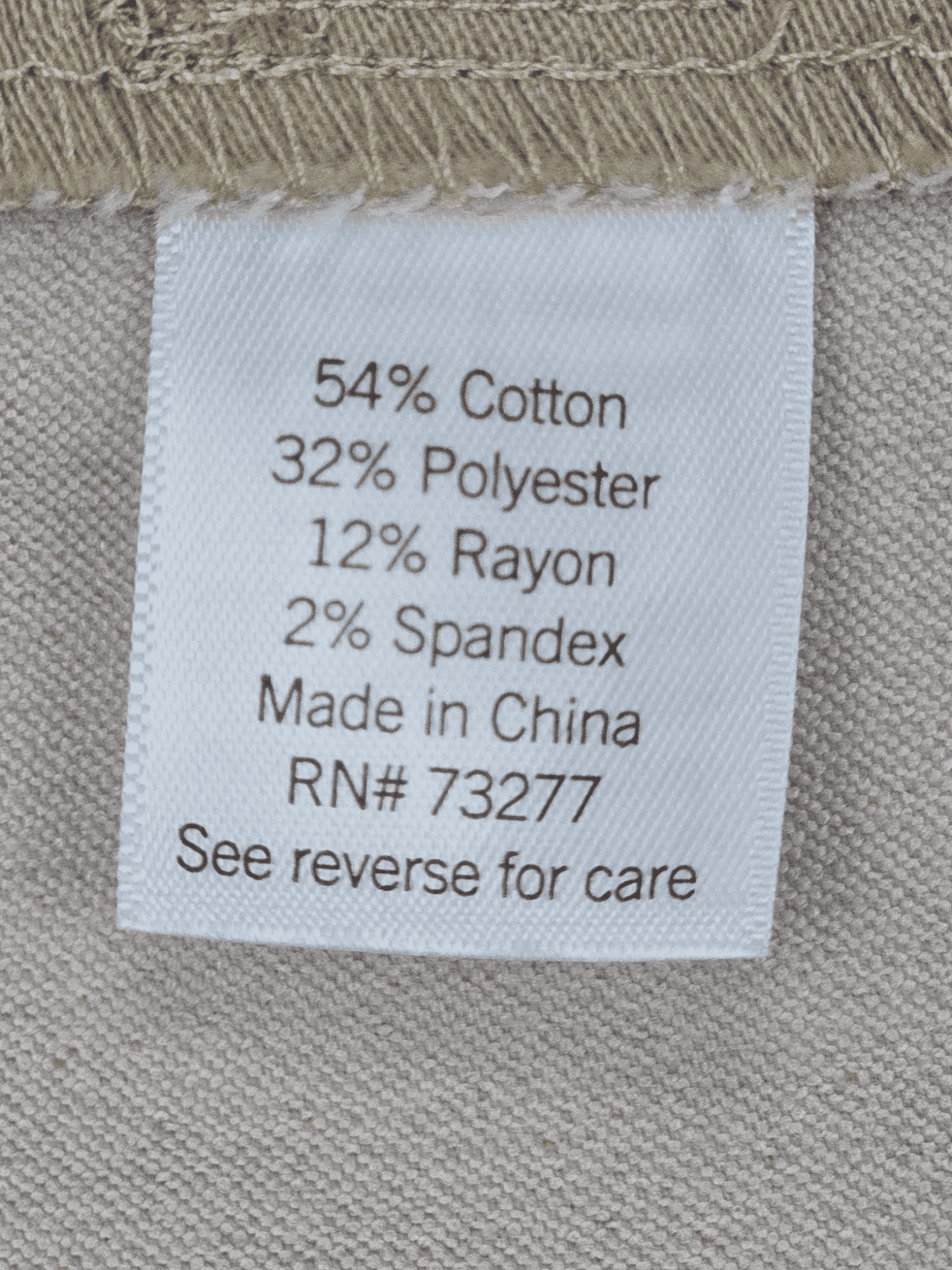 Close-up of material content and garment care tag on Croft & Barrow women’s size 24W khaki pull-on straight-leg pants