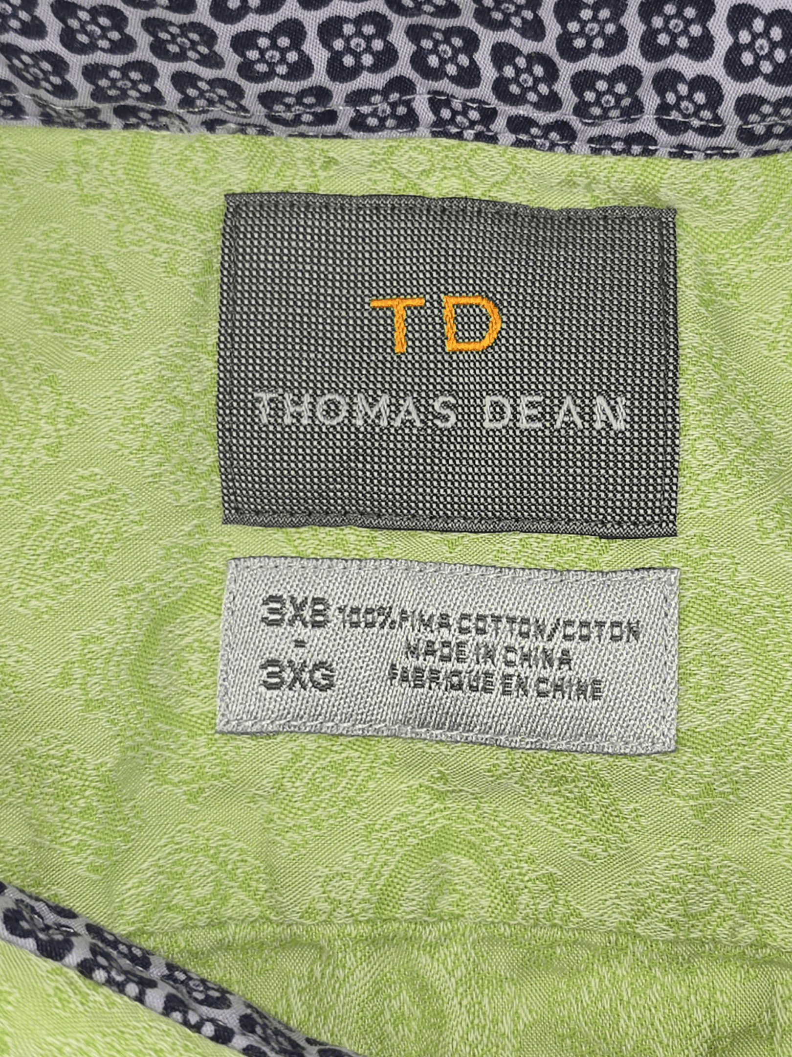 Close-up of Thomas Dean brand and 3XB size tag on light green jacquard Pima cotton button-up shirt