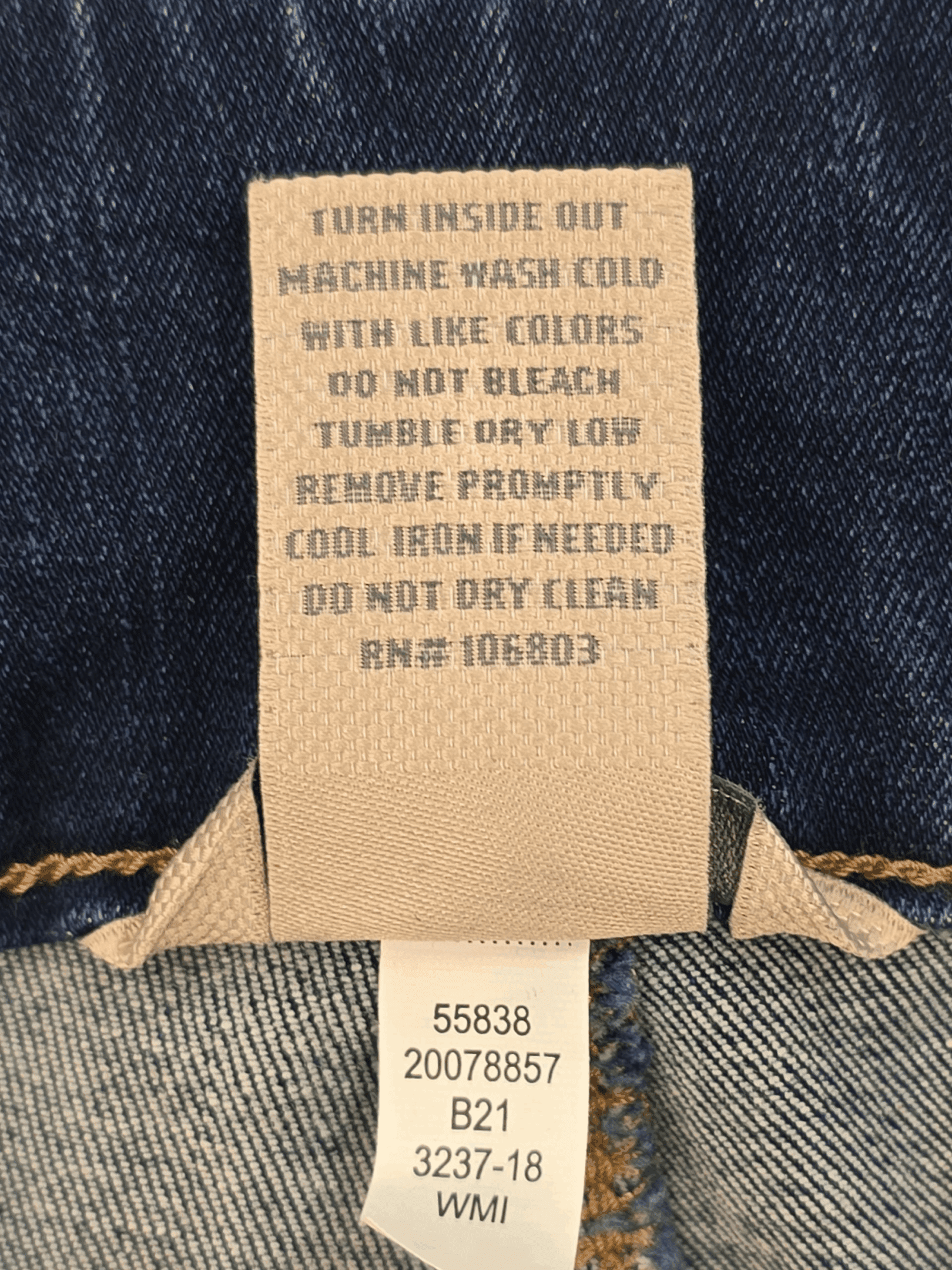 Close-up of material content and garment care tag on Duluth women’s size 24W regular blue pull-on skinny jeans
