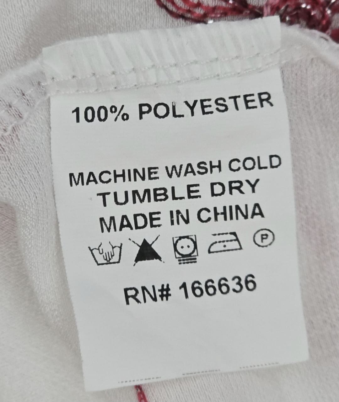 Kindred white pink floral embroidered V-neck top material content label