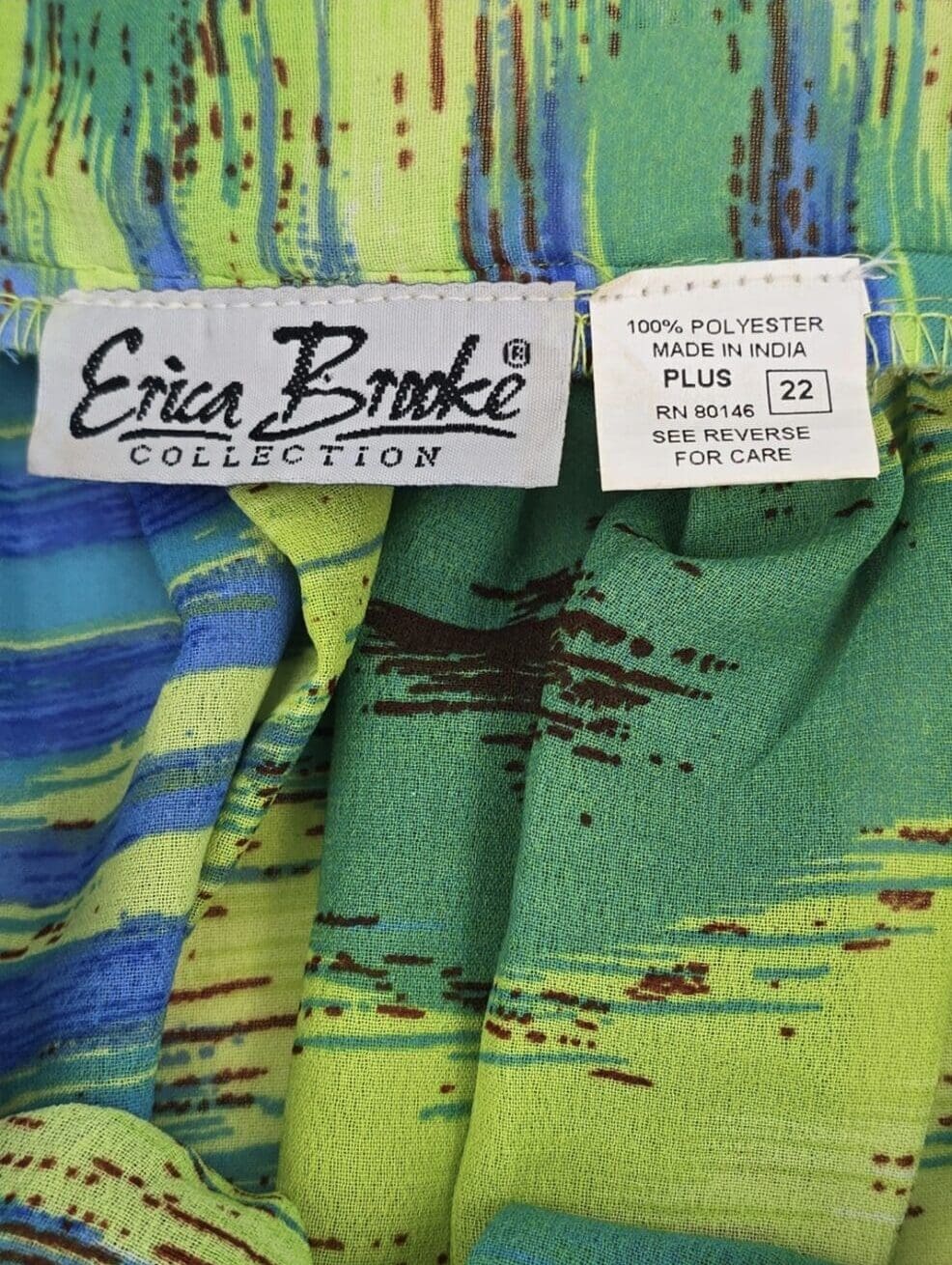 Close-up of Erica Brooke Collection brand and size 22 tag on ruffled kimono top