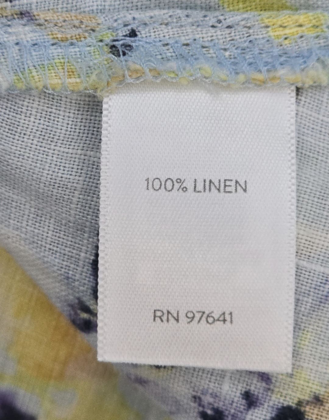 Close-up of material content and garment care tag on J. Jill Love Linen women’s size 2X floral button-up top