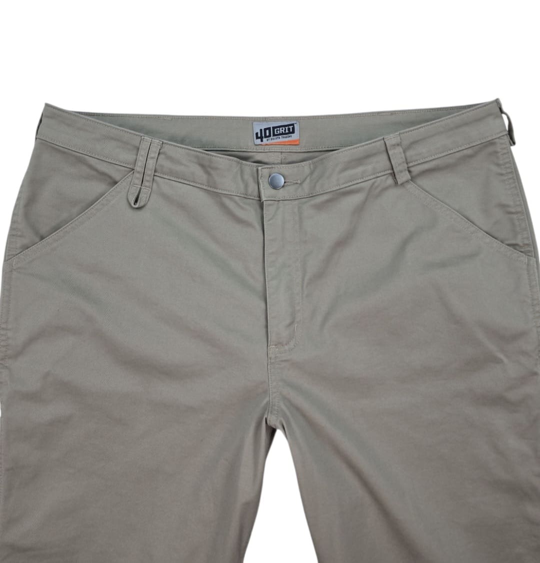 Close-up of front of Duluth Trading 40 Grit women’s size 18R khaki straight leg carpenter pants showing waistband, zipper, and pocket detail