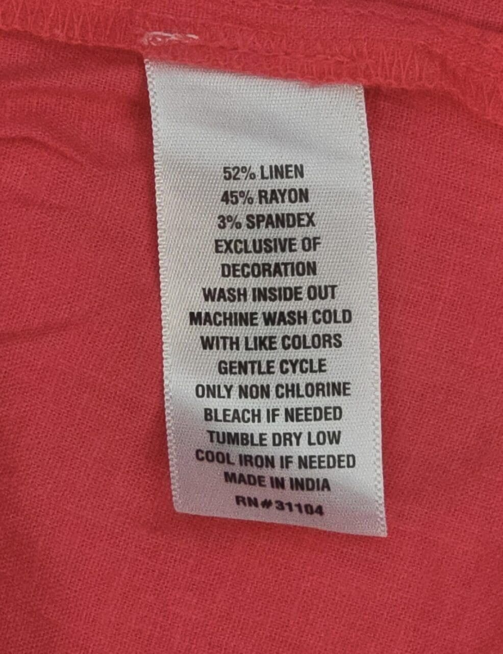 Crown & Ivy coral sleeveless V-neck pullover top with ruffle hem material content label