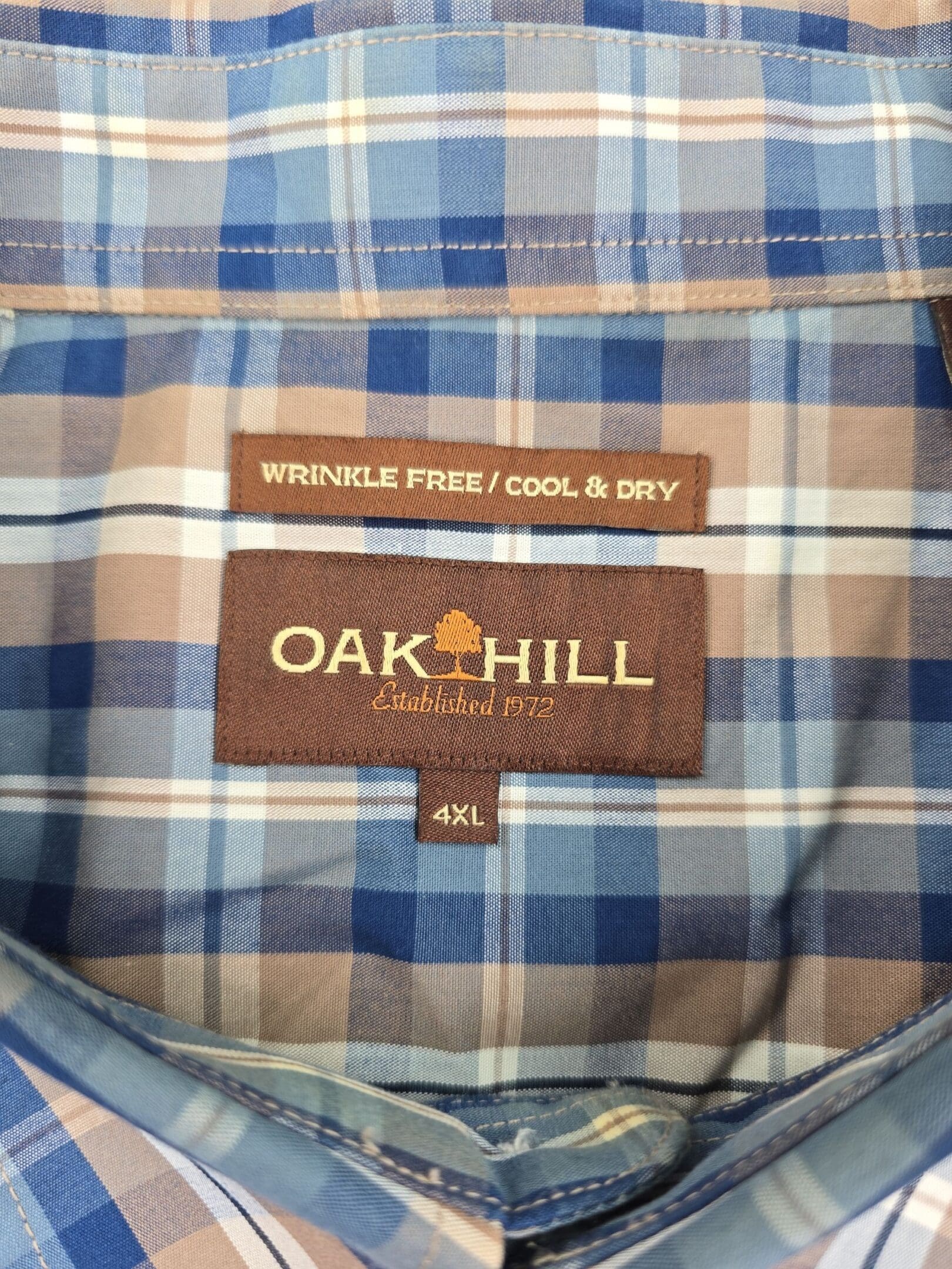 Oak Hill shirt brand and size tag showing 4XL