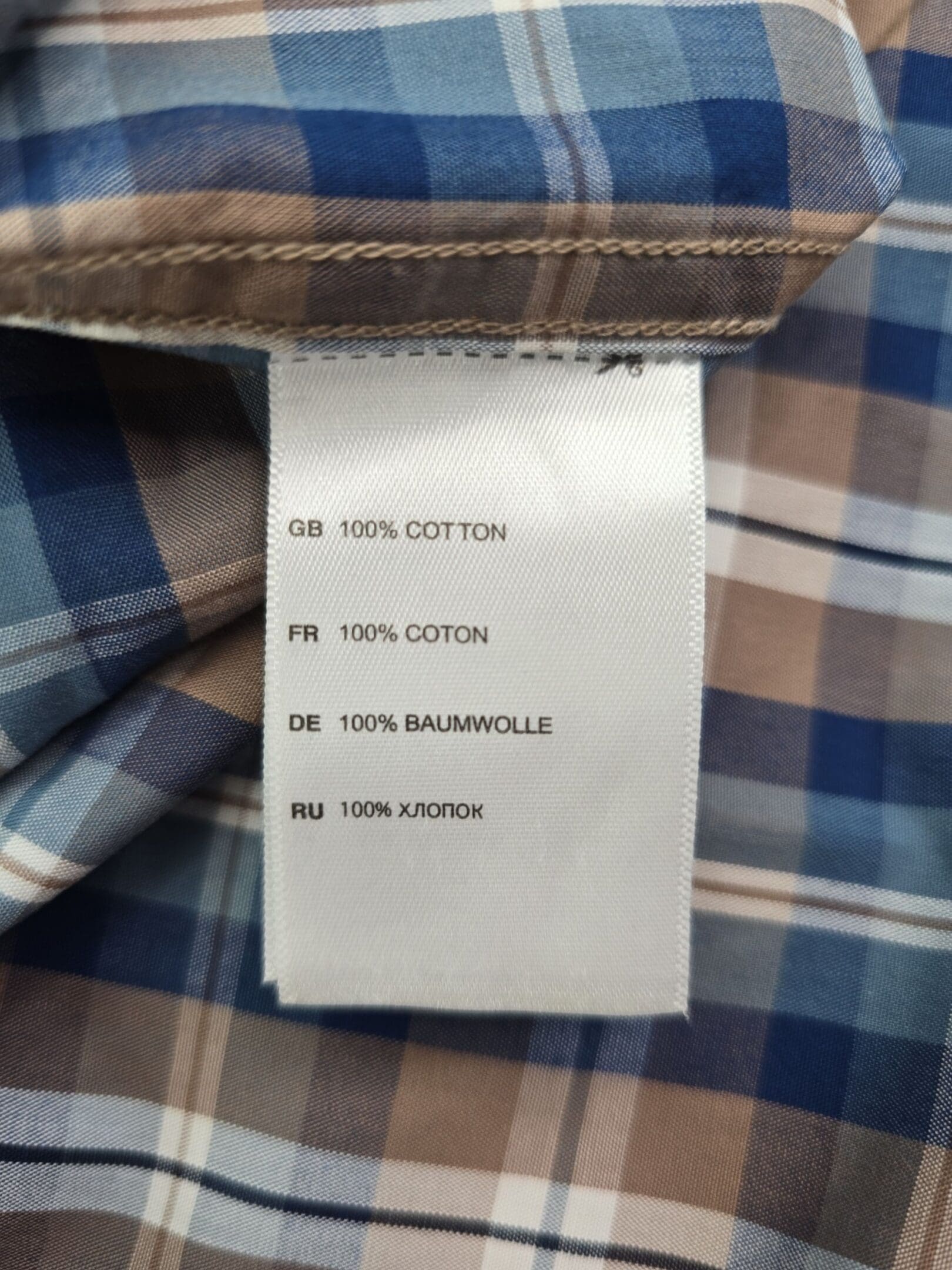 Oak Hill cool and dry shirt material tag showing 100 percent cotton