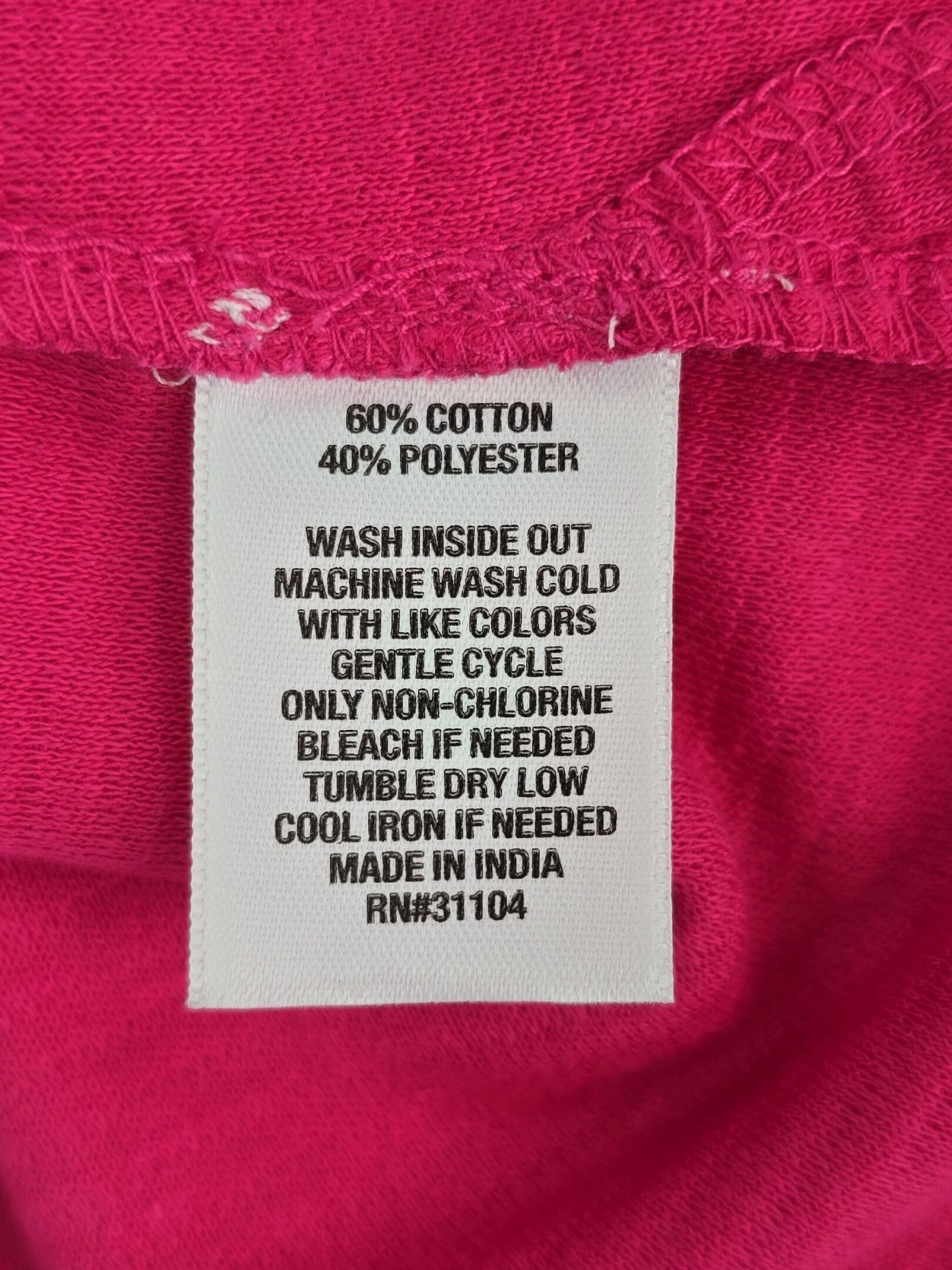 Kim Rogers pink top material and care tag cotton polyester