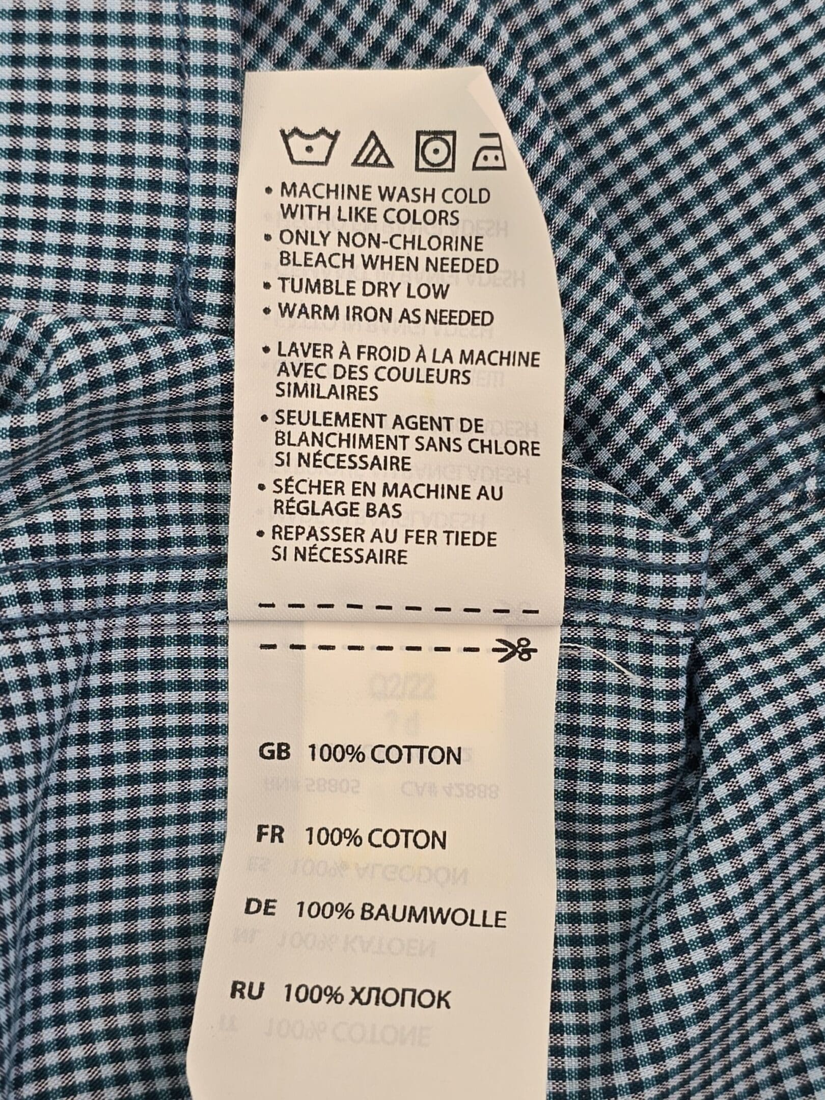 Oak Hill Premium cotton shirt care label showing washing and drying instructions