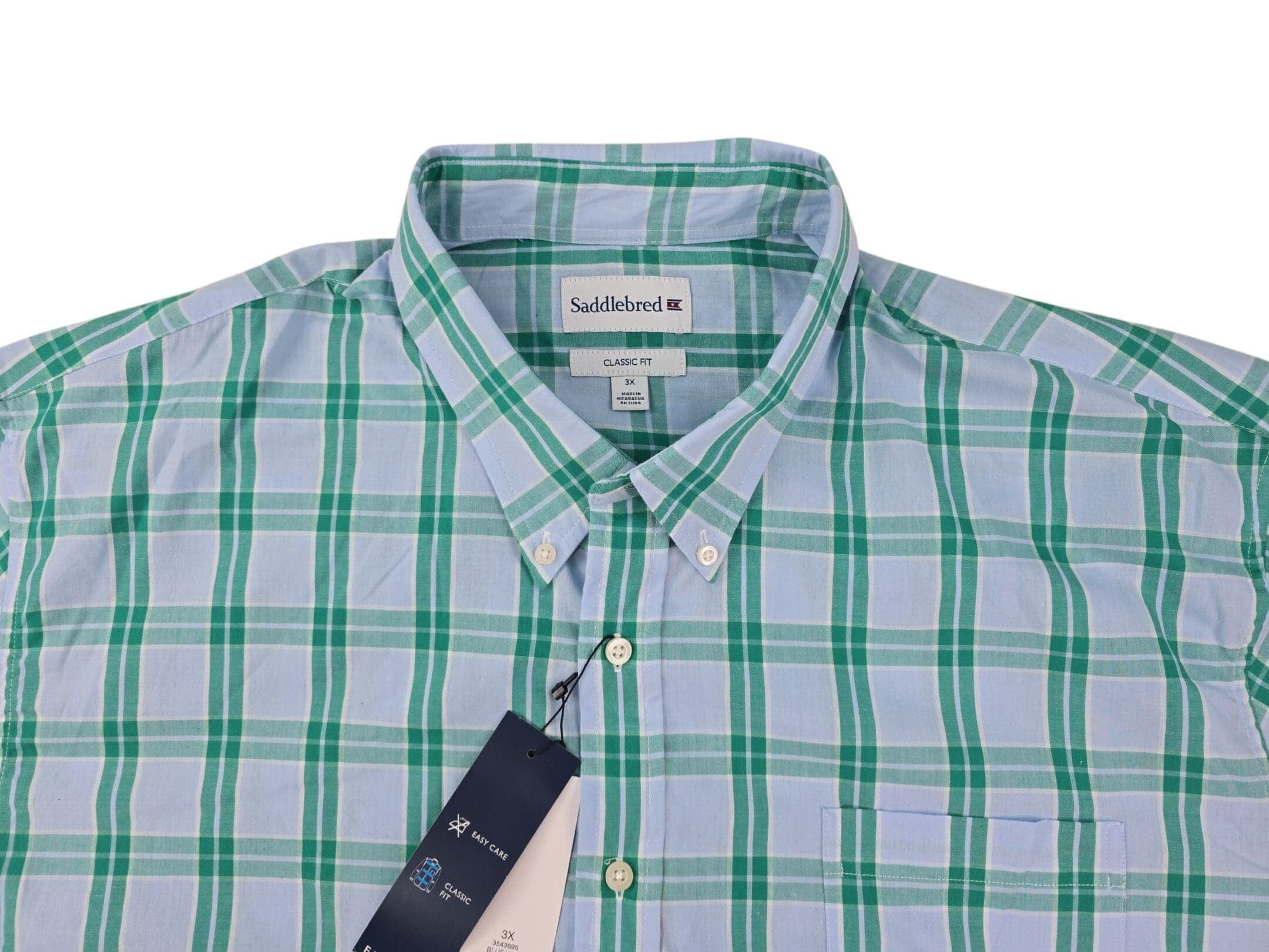 Saddlebred blue and green plaid shirt fabric close up