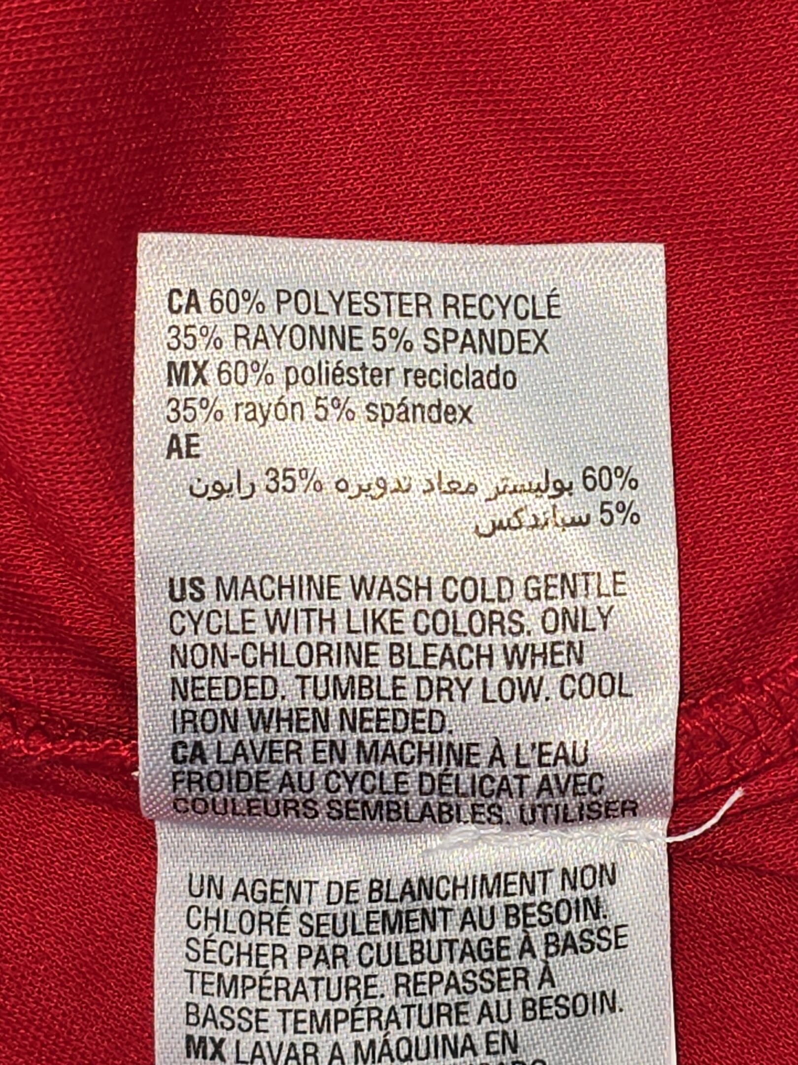 Alfani polo shirt material and care tag showing polyester rayon spandex blend