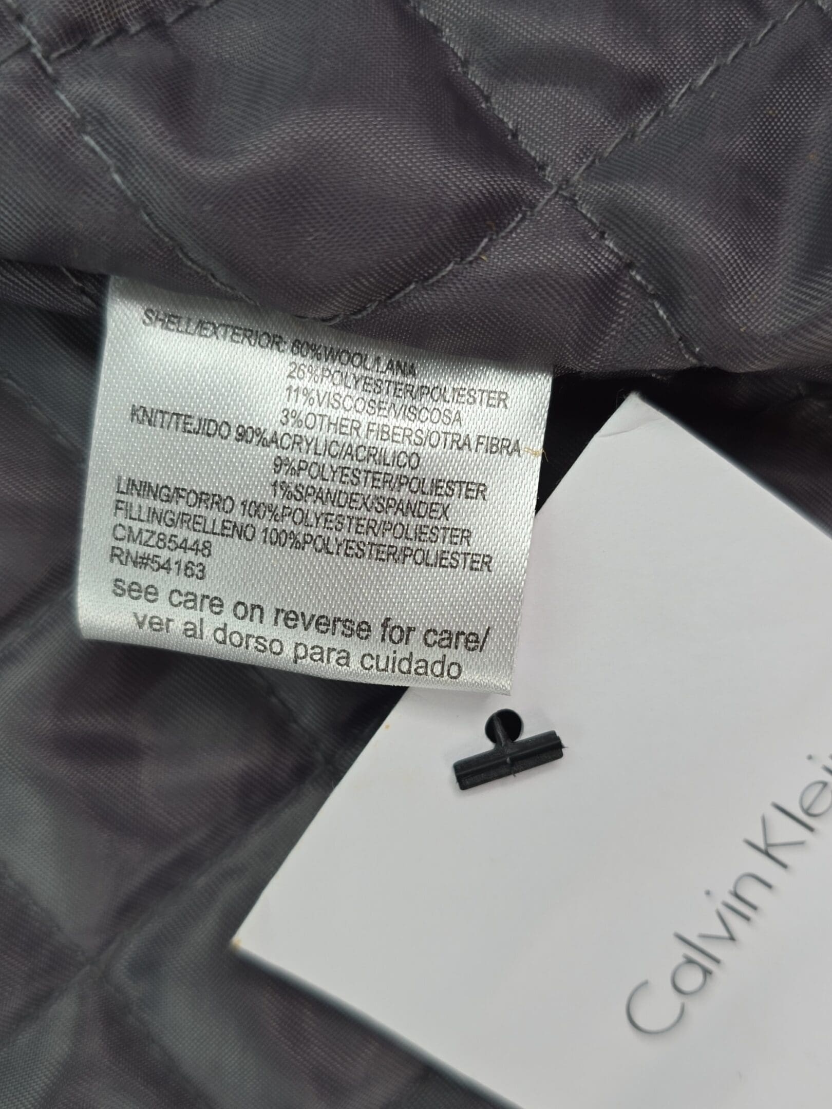 Text: Calvin Klein men’s lined winter coat material content label