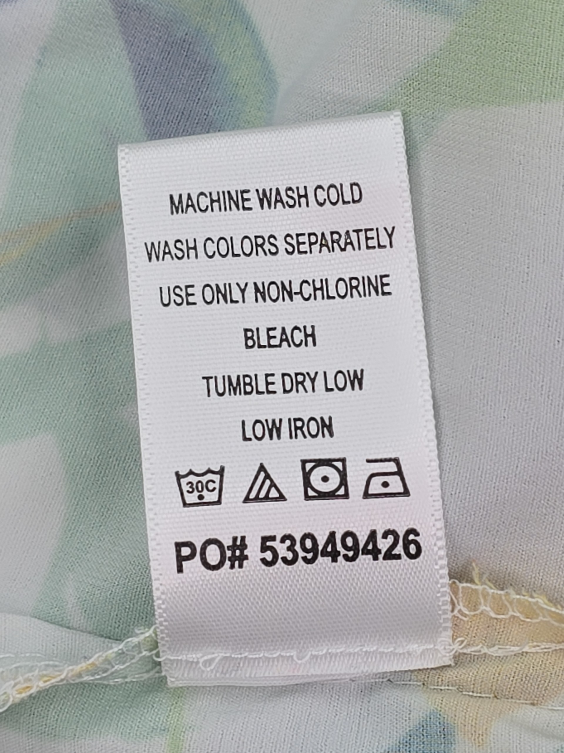 Material content and care instructions tag on Catherines blouse