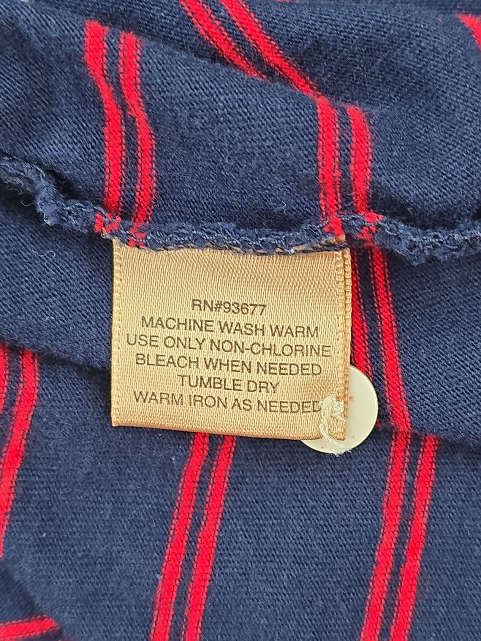 Foundry men’s polo shirt care tag with washing instructions