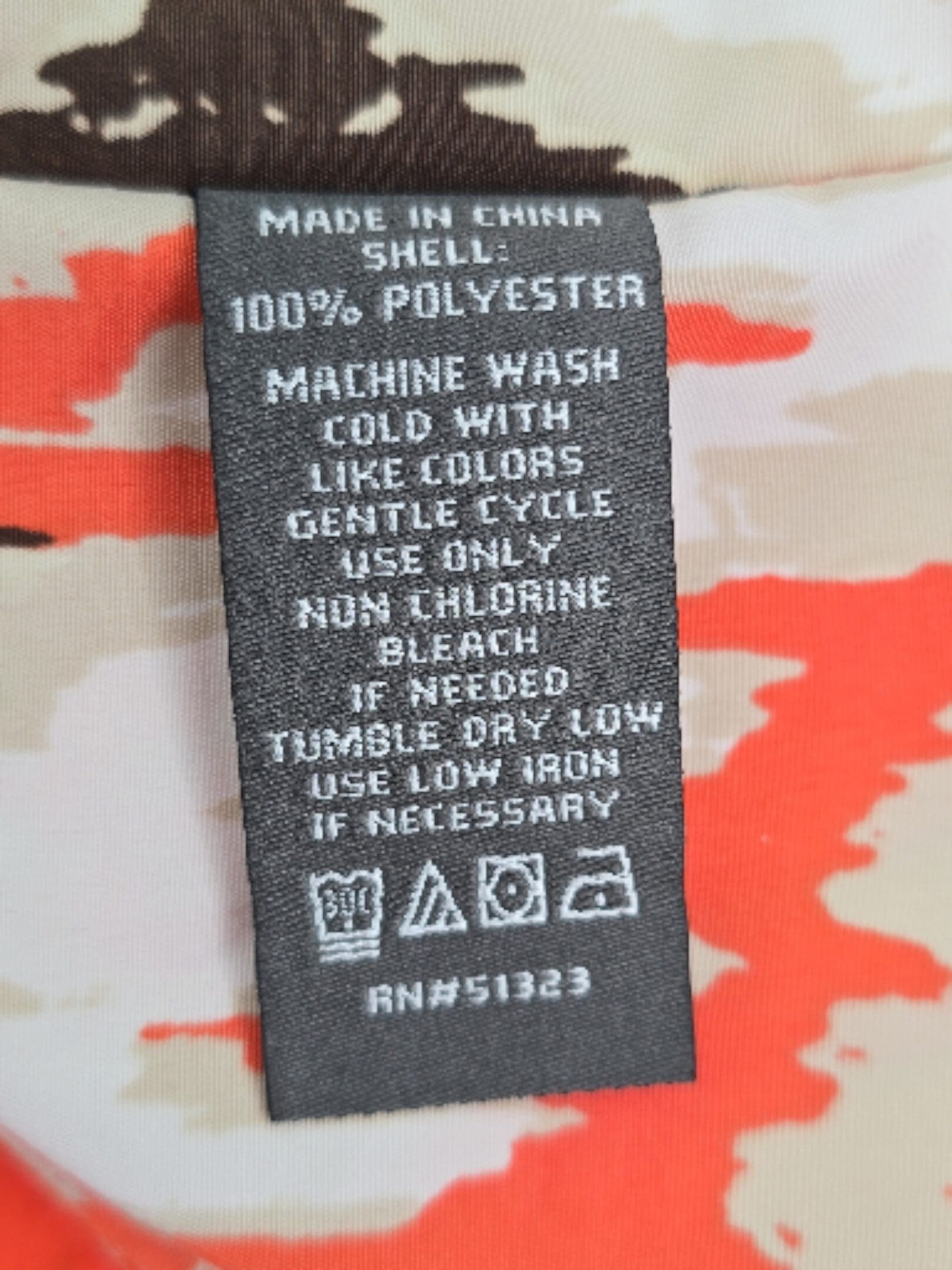 Vince Camuto caftan top material and care tag