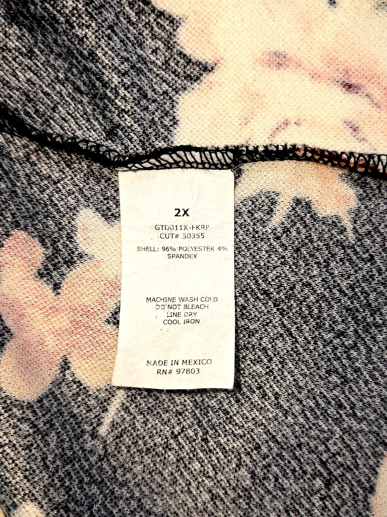 Green Envelope blouse fabric content and care instructions tag